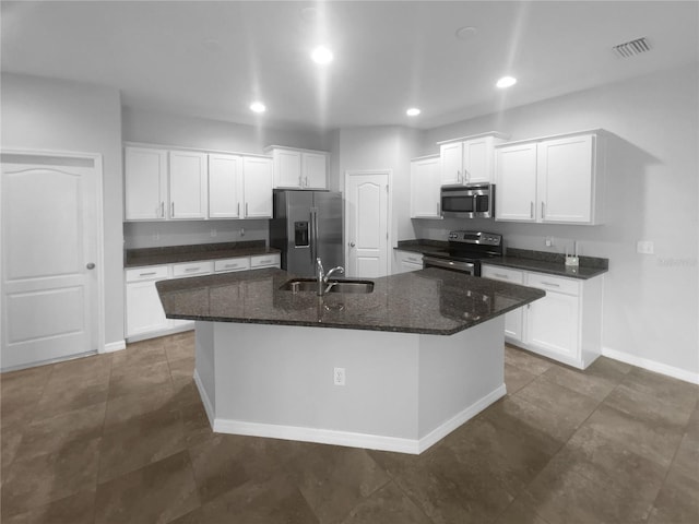 33083 Windelstraw Dr, Wesley Chapel, FL 33545 - kitchen with stainless steel appliances, a kitchen island with sink, white cabinets, and recessed lighting