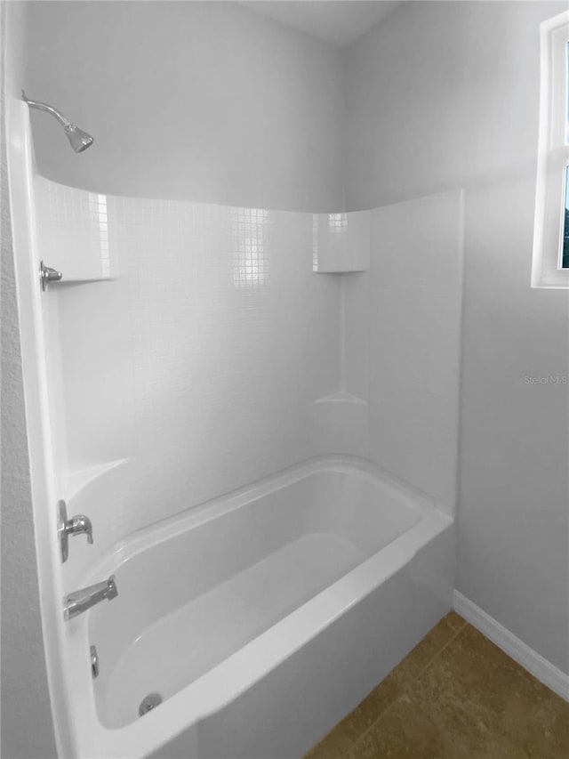 33083 Windelstraw Dr, Wesley Chapel, FL 33545 - full bathroom featuring shower / bathtub combination and tile patterned flooring