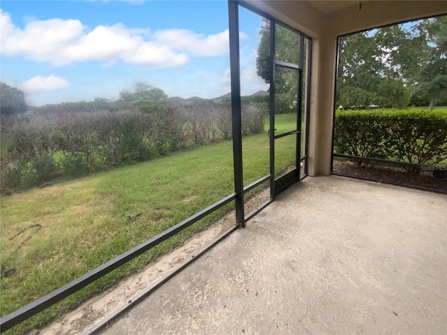 33083 Windelstraw Dr, Wesley Chapel, FL 33545 - unfurnished sunroom featuring a mountain view