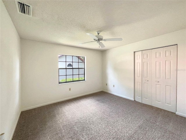 unfurnished bedroom with a closet, ceiling fan, and carpet flooring