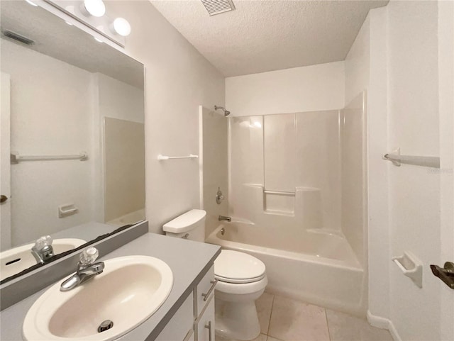 full bathroom featuring vanity, a textured ceiling, washtub / shower combination, tile patterned floors, and toilet