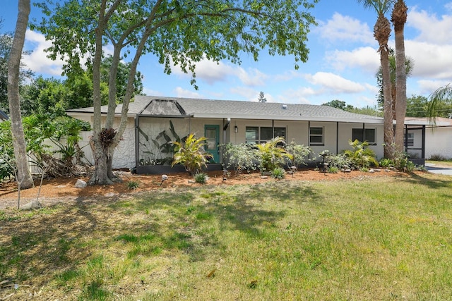 ranch-style house featuring a front yard