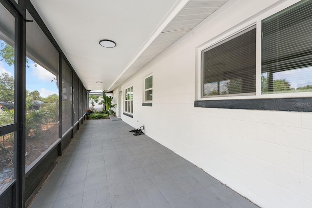 unfurnished sunroom with a wealth of natural light