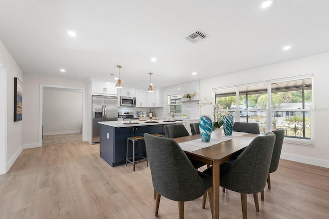 dining space featuring light hardwood / wood-style flooring