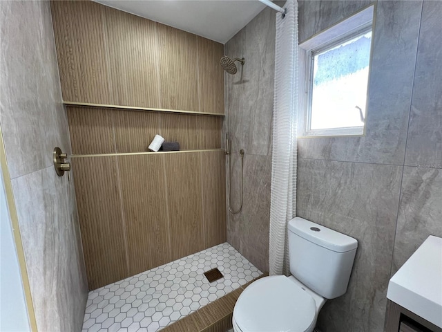 bathroom featuring a shower with curtain, toilet, and tile walls