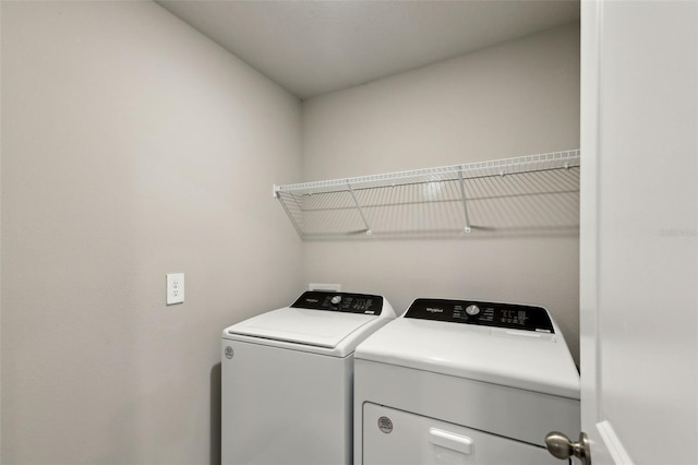 laundry area with separate washer and dryer