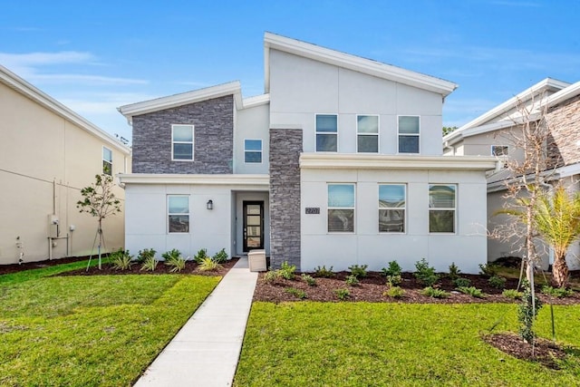 contemporary house featuring a front yard