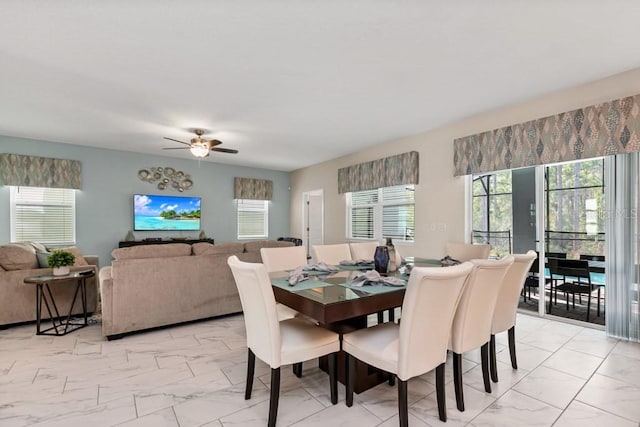 dining space with ceiling fan