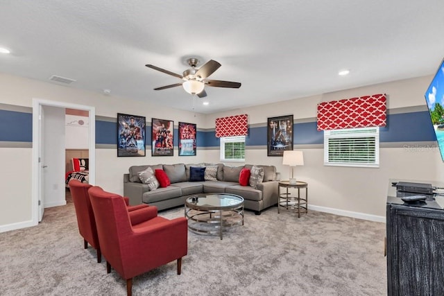 living room with ceiling fan and light colored carpet