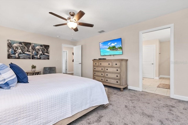 bedroom featuring light colored carpet and ceiling fan