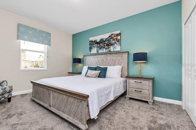 carpeted bedroom featuring a closet