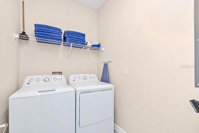 laundry room featuring washing machine and clothes dryer