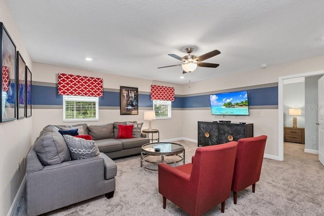 living room with light carpet and ceiling fan