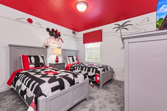 carpeted bedroom featuring a textured ceiling