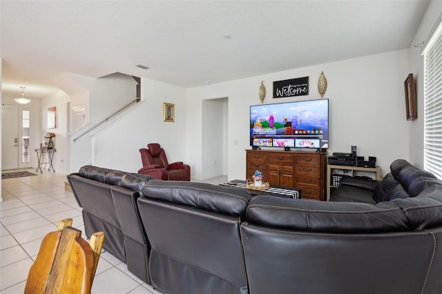 living room featuring light tile floors