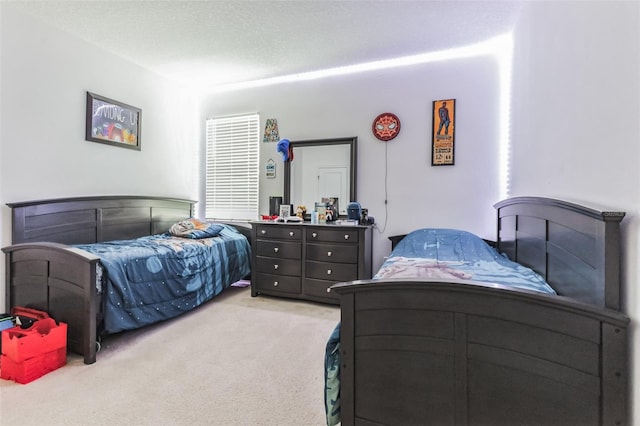 carpeted bedroom with a textured ceiling