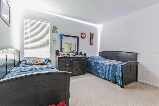 carpeted bedroom featuring a textured ceiling