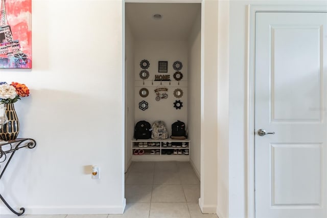 hallway featuring light tile flooring