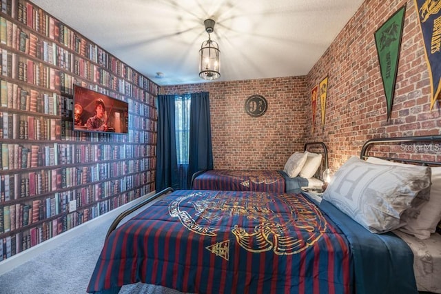 bedroom with carpet floors and brick wall