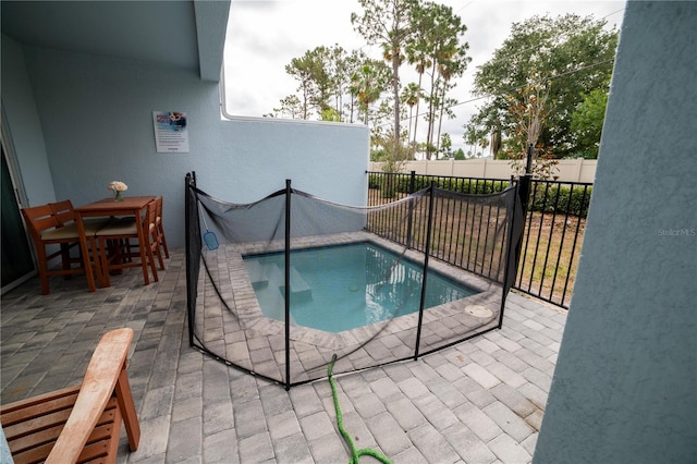 view of swimming pool featuring a patio