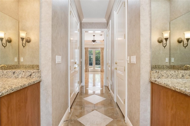 hall featuring crown molding and light tile floors