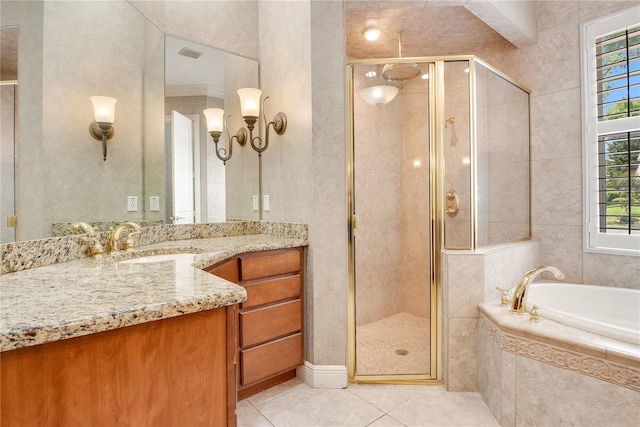 bathroom with oversized vanity, independent shower and bath, and tile flooring