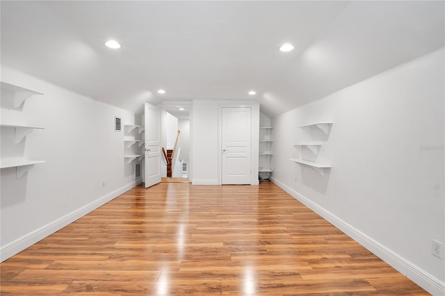 basement featuring light hardwood / wood-style flooring