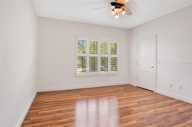 empty room featuring ceiling fan and hardwood / wood-style flooring