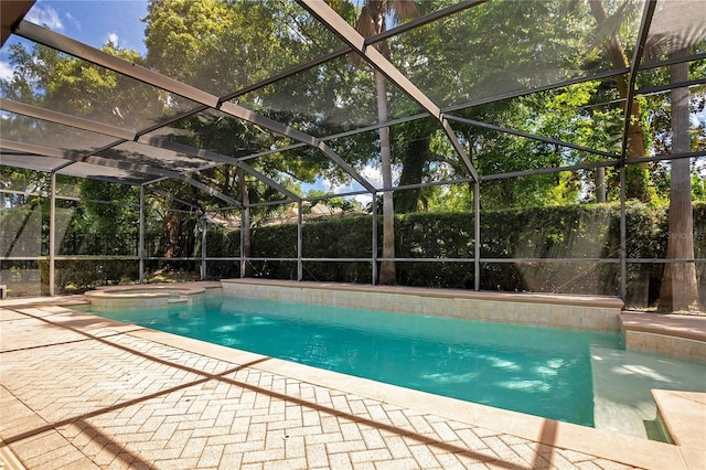 view of pool with a patio and an in ground hot tub