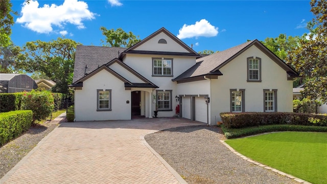 view of front of home with a front yard and a garage