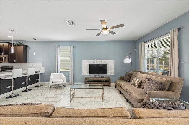 living room with ceiling fan