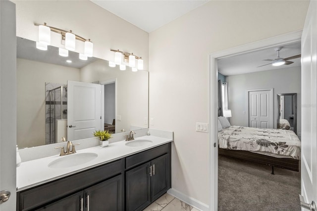 bathroom featuring ceiling fan, vanity, and a shower with door