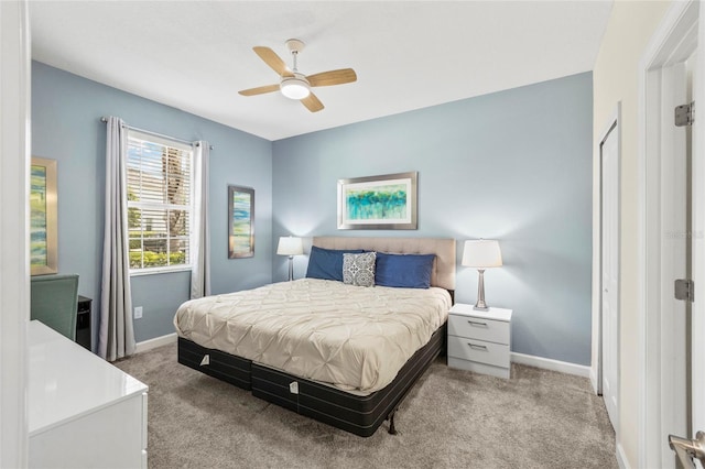 bedroom featuring light colored carpet and ceiling fan