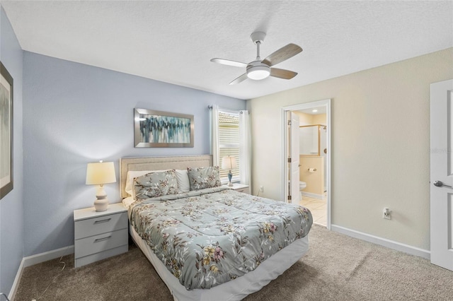 bedroom with ensuite bathroom, carpet flooring, ceiling fan, and a textured ceiling