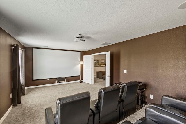 carpeted home theater room with a textured ceiling