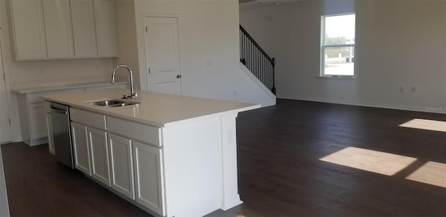 kitchen featuring white cabinetry, sink, dishwasher, and a center island with sink