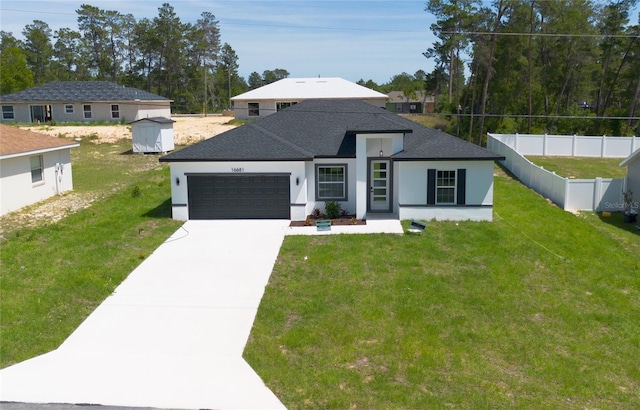 prairie-style home featuring a garage, a front lawn, and a shed