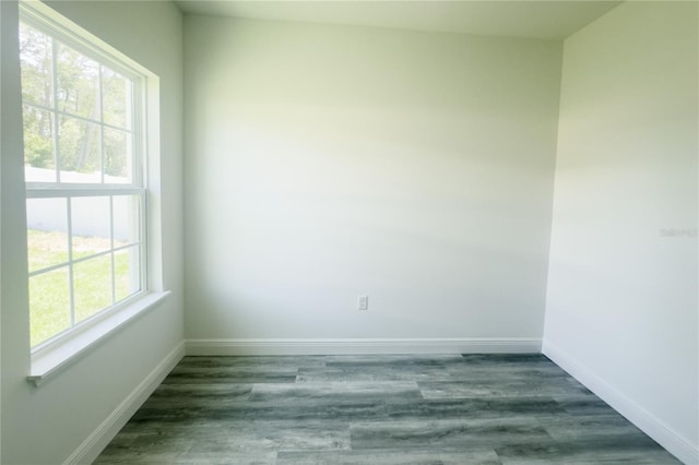 spare room featuring dark hardwood / wood-style flooring