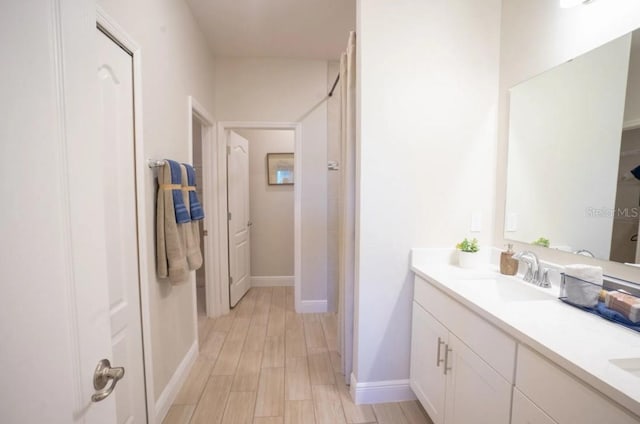 bathroom featuring hardwood / wood-style flooring and vanity