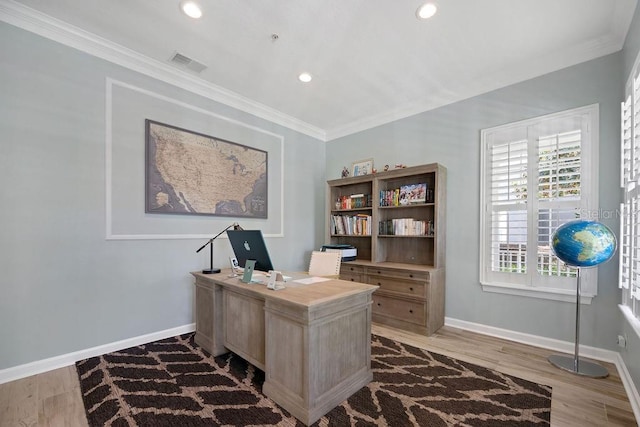 home office featuring ornamental molding and hardwood / wood-style flooring