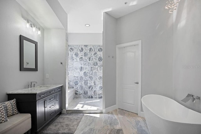 bathroom featuring vanity, tile floors, and a bathtub