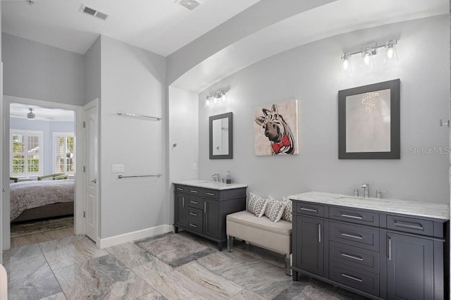 bathroom featuring dual sinks, tile floors, and large vanity