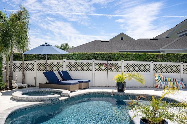 view of swimming pool featuring an in ground hot tub