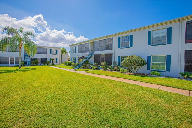 1048 Plantation Dr Unit E-9, Kissimmee, FL 34741 - view of community with a yard and stairway