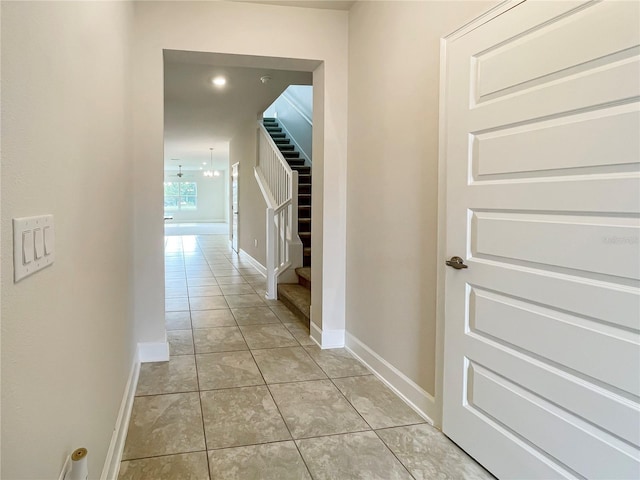 corridor featuring light tile patterned floors