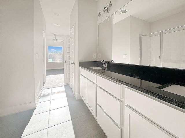 full bath featuring tile patterned floors, visible vents, a sink, and double vanity