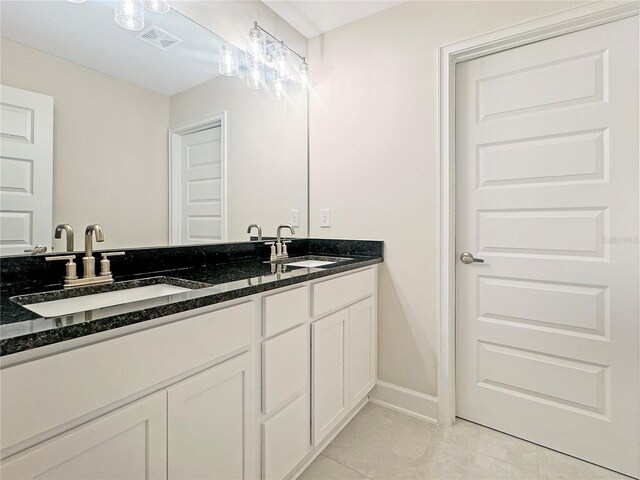 bathroom featuring tile patterned floors and vanity