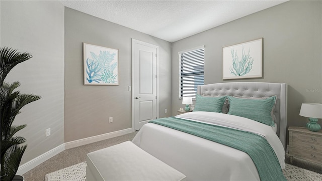 bedroom with carpet flooring and a textured ceiling