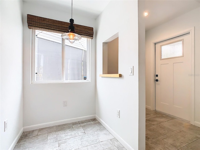 entrance foyer featuring a wealth of natural light and light tile floors