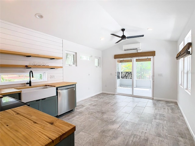 kitchen with wood counters, a wall mounted air conditioner, dishwasher, sink, and ceiling fan